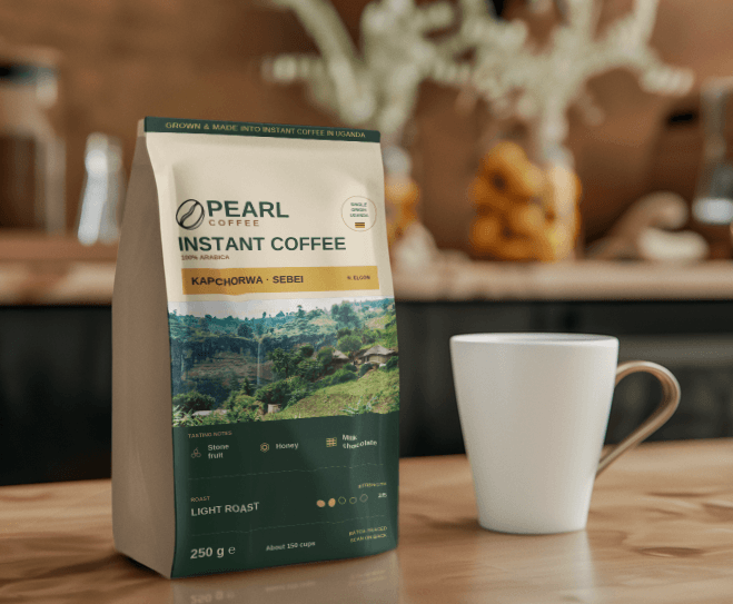 Pearl Instant Coffee — Kapchorwa · Sebei pouch beside a white cup on a café counter